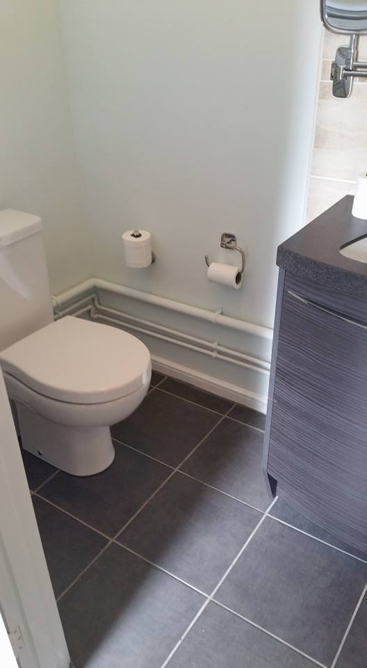 
		2 of 2: Downstairs toilet refurbishment: strip out, retiled floor and walls, fitted new toilet and hand basin unit, decorated.